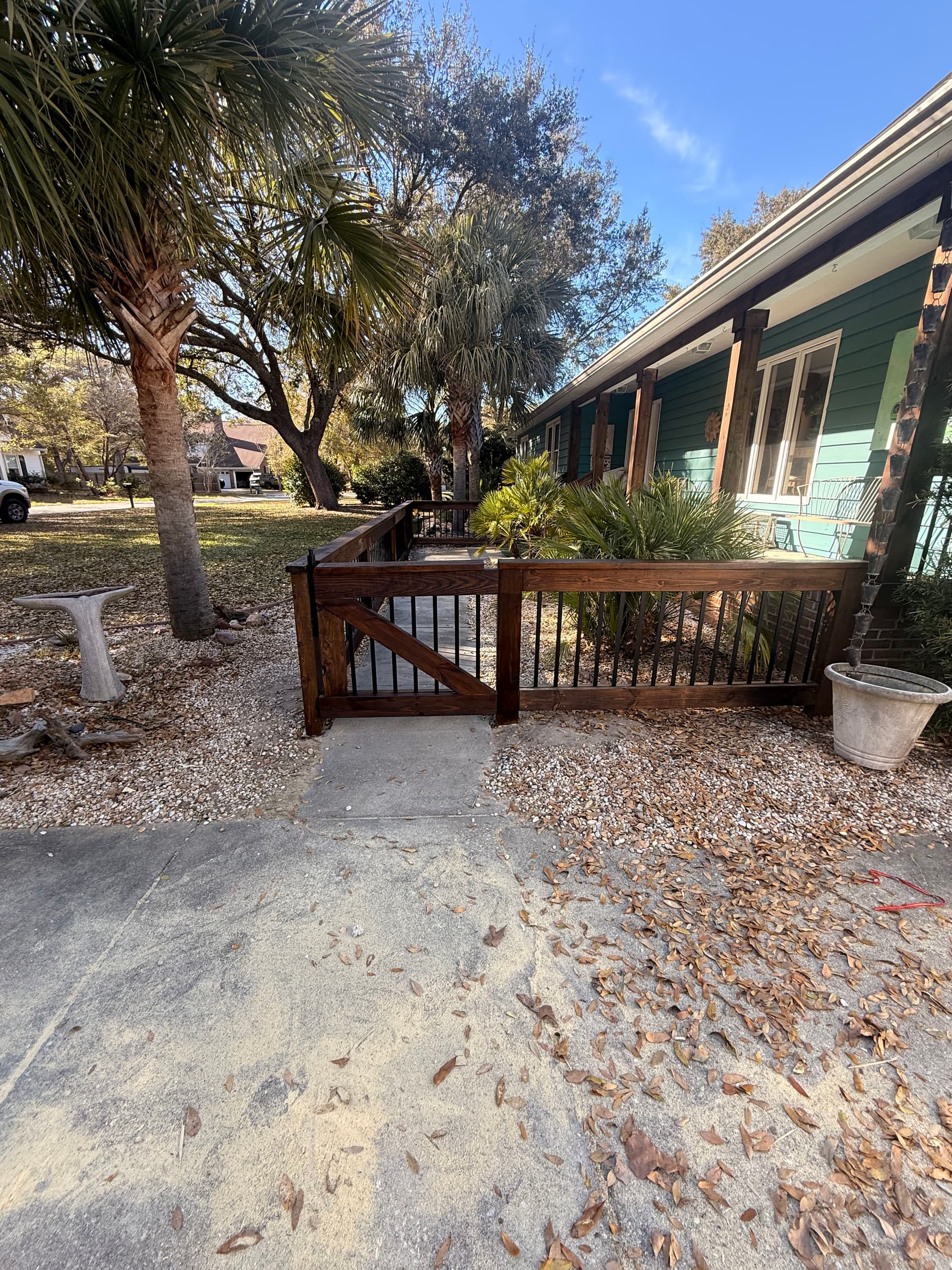 Coastal Home Makeover with Custom Fencing and Trim
