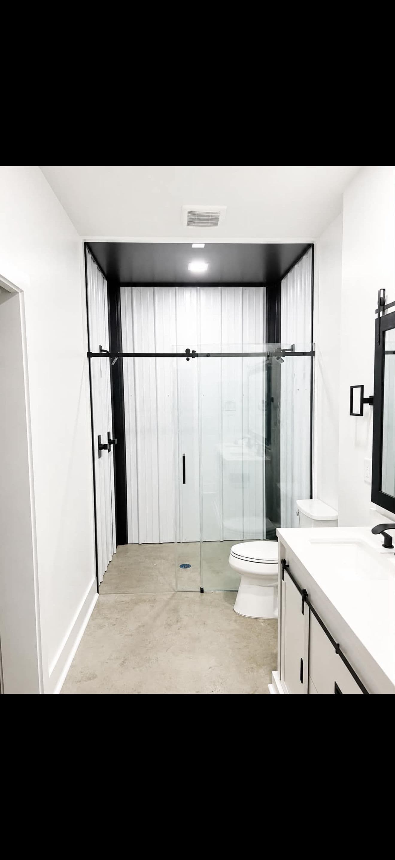 Gallery photos for Modern Bathroom Upgrade with Metal Walls and Frameless Shower Doors: Image #2