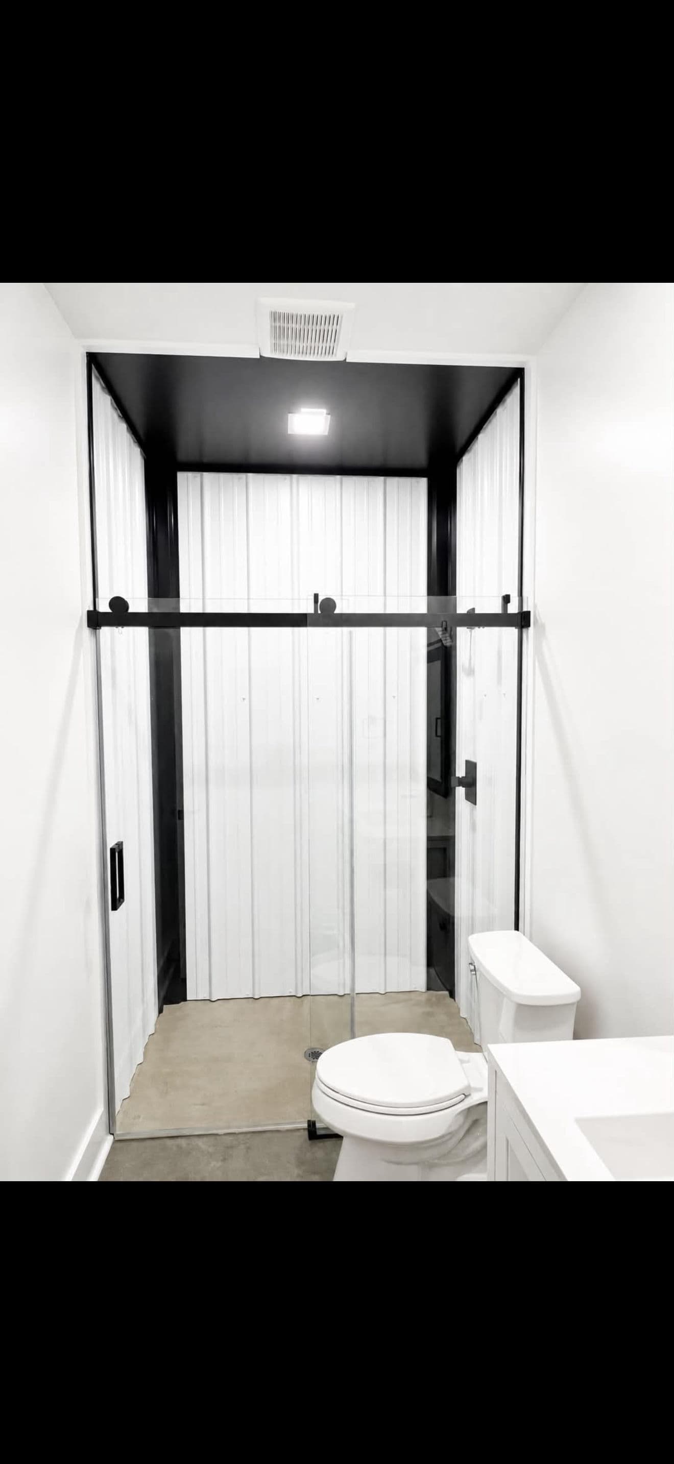 Gallery photos for Modern Bathroom Upgrade with Metal Walls and Frameless Shower Doors: Image #1